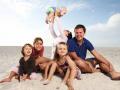 Family Having Fun On Beach